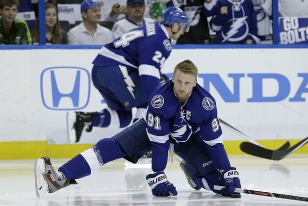Tampa Bay Lightning center Steven Stamkos (91) stretches before Game 2 of a first-round NHL hockey playoff series against the Montreal Canadiens Friday, April 18, 2014, in Tampa, Fla. (AP Photo/Chris O'Meara)