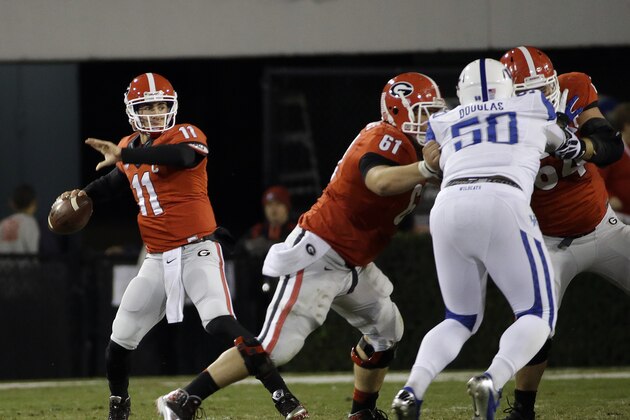 Georgia quarterback Aaron Murray (11) throws from the pocket in the first half of an NCAA college football game against Kentucky, Saturday, Nov. 23, 2013, in Athens, Ga. (AP Photo/John Bazemore)