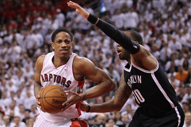 TORONTO, ON - MAY4:  Marcus Thornton #10 of the Brooklyn Nets defends against DeMar DeRozan #10 of the Toronto Raptors in Game Seven of the NBA Eastern Conference Quarterfinals at the Air Canada Centre on May 4, 2014 in Toronto, Ontario, Canada. The Nets defeated the Raptors 114-113 to win the series 4-3. NOTE TO USER: user expressly acknowledges and agrees by downloading and/or using this Photograph, user is consenting to the terms and conditions of the Getty Images License Agreement. (Photo by Claus Andersen/Getty Images)