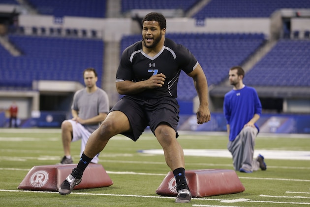 Pittsburgh defensive lineman Aaron Donald runs a drill at the NFL football scouting combine in Indianapolis, Monday, Feb. 24, 2014. (AP Photo/Michael Conroy)