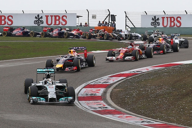 SHANGHAI, CHINA - APRIL 20:  Lewis Hamilton of Great Britain and Mercedes GP leads Sebastian Vettel of Germany and Infiniti Red Bull Racing and Fernando Alonso of Spain and Ferrari into the third corner during the Chinese Formula One Grand Prix at the Shanghai International Circuit on April 20, 2014 in Shanghai, China.  (Photo by Justin Davies/Getty Images)