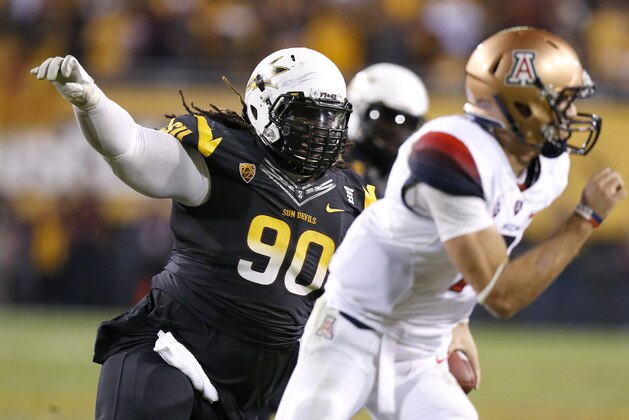 Arizona State's Will Sutton (90) tries to run down Arizona's B.J. Denker during the second half of an NCAA college football game Saturday, Nov. 30, 2013, in Tempe, Ariz.  Arizona State defeated Arizona 58-21. (AP Photo/Ross D. Franklin)