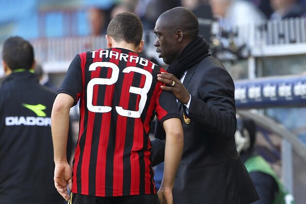 GENOA, ITALY - FEBRUARY 23:  Coach Clarence Seedorf of AC Milan issues instructions to his player Adel Taarabt during the Serie A match between UC Sampdoria and AC Milan at Stadio Luigi Ferraris on February 23, 2014 in Genoa, Italy.  (Photo by Marco Luzzani/Getty Images)