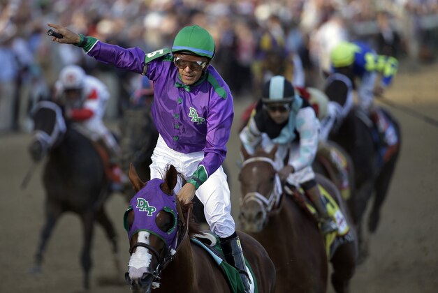 Victor Espinoza rides California Chrome to a victory during the 140th running of the Kentucky Derby horse race at Churchill Downs Saturday, May 3, 2014, in Louisville, Ky. (AP Photo/David J. Phillip)