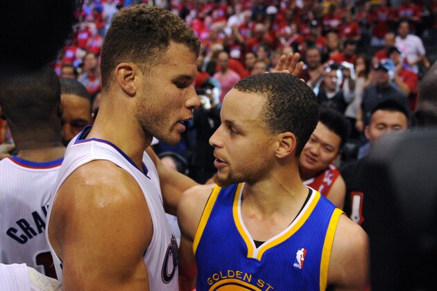 Los Angeles Clippers forward Blake Griffin, left, hugs Golden State Warriors guard Stephen Curry after Game 7 of an opening-round NBA basketball playoff series, Saturday, May 3, 2014, in Los Angeles. The Clippers won 126-121. (AP Photo/Mark J. Terrill)
