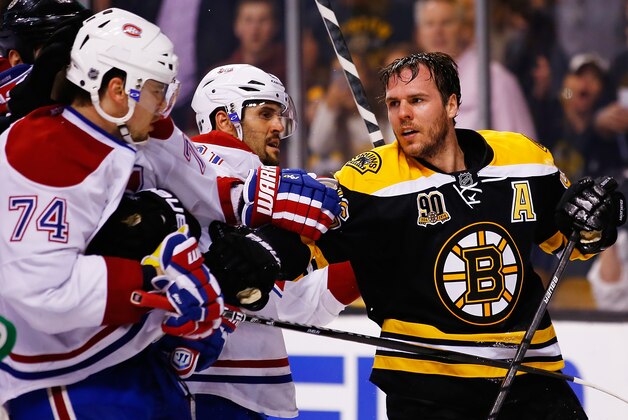 BOSTON, MA - MAY 03: David Krejci #46 of the Boston Bruins loses his helmet in a scuffle with members of the Montreal Canadiens in the third period in Game Two of the Second Round of the 2014 NHL Stanley Cup Playoffs at TD Garden on May 3, 2014 in Boston, Massachusetts.  (Photo by Jared Wickerham/Getty Images)