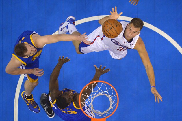 Los Angeles Clippers forward Blake Griffin, right, puts up a shot as Golden State Warriors forward David Lee, left, and forward Draymond Green defend during the first half in Game 7 of an opening-round NBA basketball playoff series, Saturday, May 3, 2014, in Los Angeles. (AP Photo/Mark J. Terrill)