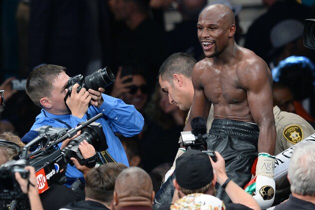 LAS VEGAS, NV - MAY 03:  Floyd Mayweather Jr. celebrates after defeating Marcos Maidana by majority decision in their WBC/WBA welterweight unification fight at the MGM Grand Garden Arena on May 3, 2014 in Las Vegas, Nevada.  (Photo by Ethan Miller/Getty Images)