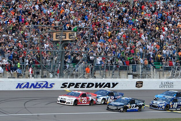 Oct 6, 2013; Kansas City, KS, USA; NASCAR Sprint Cup Series driver Kevin Harvick (29) leads the field to green during race action for the Hollywood Casino 400 at Kansas Speedway. Mandatory Credit: Mike DiNovo-USA TODAY Sports