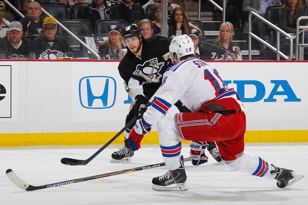 PITTSBURGH, PA - MAY 4:  Kris Letang #58 of the Pittsburgh Penguins shoots and scores in front of Marc Staal #18 of the New York Rangers in Game Two of the Second Round of the 2014 Stanley Cup Playoffs at Consol Energy Center on May 4, 2014 in Pittsburgh, Pennsylvania.  (Photo by Gregory Shamus/NHLI via Getty Images)