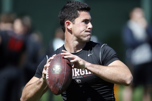 Former Georgia quarterback Aaron Murray works out for NFL football scouts during the school's pro day Wednesday, April 16, 2014 in Athens, Ga.   (AP Photo/John Bazemore)