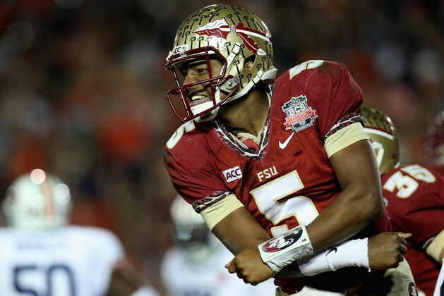 PASADENA, CA - JANUARY 06:  Quarterback Jameis Winston #5 of the Florida State Seminoles celebrates after a 2-yard pass for a touchdown to take a 33-31 lead over the Auburn Tigers in the final moments of the fourth quarter during the 2014 Vizio BCS National Championship Game at the Rose Bowl on January 6, 2014 in Pasadena, California. Florida State lead 34-31 after a successful extra point.  (Photo by Stephen Dunn/Getty Images)