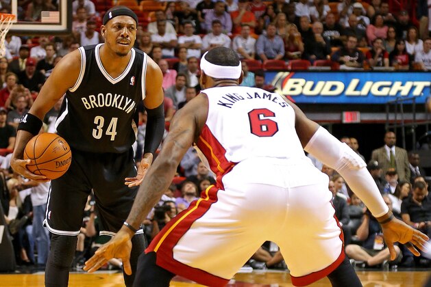 MIAMI, FL - APRIL 08:  LeBron James #6 of the Miami Heat guards Paul Pierce #34 of the Brooklyn Nets during a game  at AmericanAirlines Arena on April 8, 2014 in Miami, Florida. NOTE TO USER: User expressly acknowledges and agrees that, by downloading and/or using this photograph, user is consenting to the terms and conditions of the Getty Images License Agreement. Mandatory copyright notice:  (Photo by Mike Ehrmann/Getty Images)