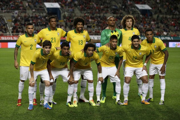 Brazil's national soccer team players, back row from left, Daniel Alves, Jo, Dante, Jefferson and David Luiz, front row from left, Oscar, Paulinho, Marcelo, Neymar, Hulk and Luiz Gustavo pose for pictures before their friendly soccer match against South Korea at Seoul World Cup Stadium in Seoul, South Korea, Saturday, Oct.12, 2013. (AP Photo/Lee Jin-man)