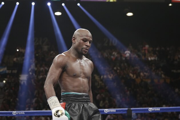 Floyd Mayweather Jr. stands in the ring during his WBC-WBA welterweight title boxing fight against Marcos Maidana Saturday, May 3, 2014, in Las Vegas. (AP Photo/Isaac Brekken)