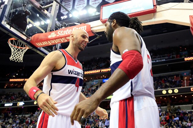 WASHINGTON, DC - NOVEMBER 08: Marcin Gortat #4 and Nene Hilario #42 of the Washington Wizards celebrate after during the second half of the Wizards 112-108 overtime win over the Brooklyn Nets at Verizon Center on November 8, 2013 in Washington, DC. NOTE TO USER: User expressly acknowledges and agrees that, by downloading and or using this photograph, User is consenting to the terms and conditions of the Getty Images License Agreement.  (Photo by Rob Carr/Getty Images)