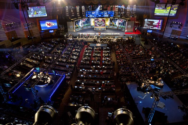 Sports anchors, fans and journalists fill the floor at the fourth through seventh rounds of the NFL Draft Saturday, April 27, 2013 at Radio City Music Hall in New York. (AP Photo/Craig Ruttle)