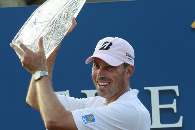 Matt Kuchar with the winners trophy at the Players Championship golf tournament at TPC Sawgrass, Sunday, May 13, 2012, in Ponte Vedra Beach, Fla. (AP Photo/John Raoux)