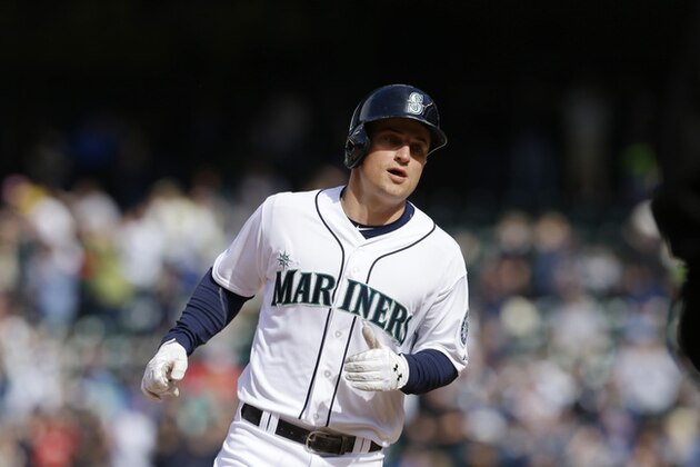 Seattle Mariners' Kyle Seager runs the bases after hitting a solo home run against the Texas Rangers, Sunday, April 27, 2014 in a baseball game in Seattle. (AP Photo/Ted S. Warren)