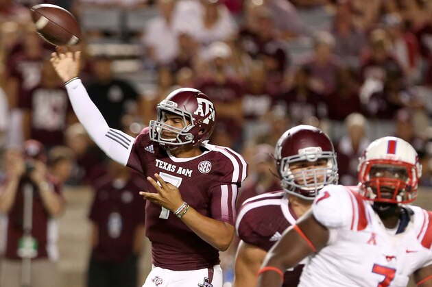 HOUSTON, TX- SEPTEMBER 21: Kenny Hill #7 of the Texas A&M Aggies completes a pass against the Southern Methodist Mustangs in the second half on September 21, 2013 at Kyle Field in College Station, Texas. (Photo by Thomas B. Shea/Getty Images)