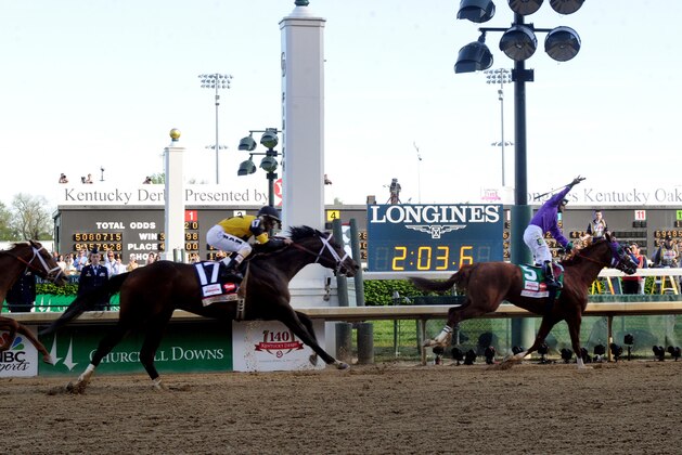 IMAGE DISTRIBUTED FOR LONGINES - California Chrome, ridden by jockey Victor Espinoza, celebrates as he wins the 140th Kentucky Derby, Saturday, May 3, 2014, in Louisville, Ky. Longines, the Swiss watchmaker known for its famous timepieces, is the Official Watch and Timekeeper of the 140th annual Kentucky Derby. (Photo by Diane Bondareff/Invision for Longines/AP Images)