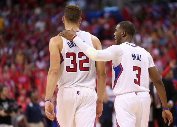 LOS ANGELES, CA - MAY 03:  Blake Griffin #32 and Chris Paul #3 of the Los Angeles Clippers walk together on the court as the play the Golden State Warriors in Game Seven of the Western Conference Quarterfinals during the 2014 NBA Playoffs at Staples Center on May 3, 2014 in Los Angeles, California. The Clippers won 126-121 to win the series four games to three.  NOTE TO USER: User expressly acknowledges and agrees that, by downloading and or using this photograph, User is consenting to the terms and conditions of the Getty Images License Agreement.  (Photo by Stephen Dunn/Getty Images)