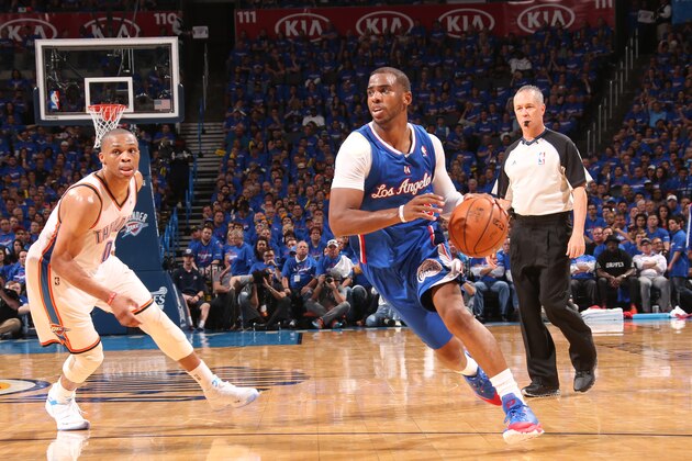 OKLAHOMA CITY, OK - May 5, 2014: Chris Paul #3 of the Los Angeles Clippers dribbles the ball against the Oklahoma City Thunder in Game 1 of the Western Conference Semifinals during the 2014 NBA Playoffs at the Chesapeake Arena on May 5, 2014 in Oklahoma City, Oklahoma. NOTE TO USER:  User expressly acknowledges and agrees that, by downloading and/or using this photograph, user is consenting to the terms and conditions of the Getty Images License Agreement. Mandatory Copyright Notice:  Copyright 2014 NBAE (Photo by Layne Murdoch/NBAE via Getty Images)