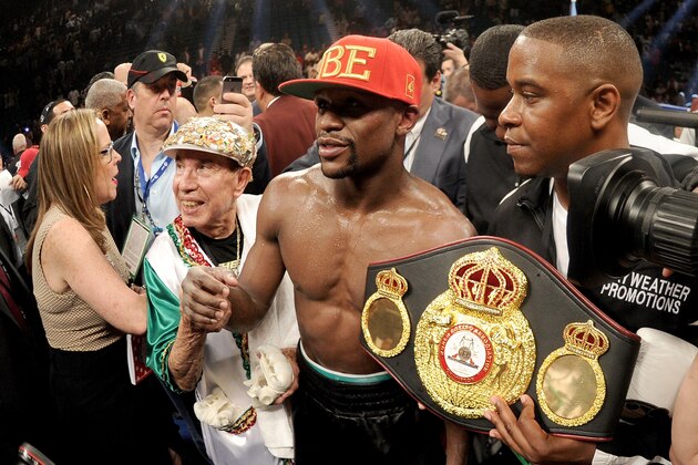 LAS VEGAS, NV - MAY 03:  Floyd Mayweather Jr. celebrates after defeating Marcos Maidana by majority decision in their WBC/WBA welterweight unification fight at the MGM Grand Garden Arena on May 3, 2014 in Las Vegas, Nevada.  (Photo by Harry How/Getty Images)