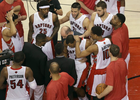 May 4, 2014; Toronto, Ontario, CAN; Toronto Raptors guard DeMar DeRozan (10) and teammates console point guard Kyle Lowry (7) after coming up short on the final play of the game against the Brooklyn Nets in game seven of the first round of the 2014 NBA Playoffs at Air Canada Centre. The Nets beat the Raptors 104-103. Mandatory Credit: Tom Szczerbowski-USA TODAY Sports
