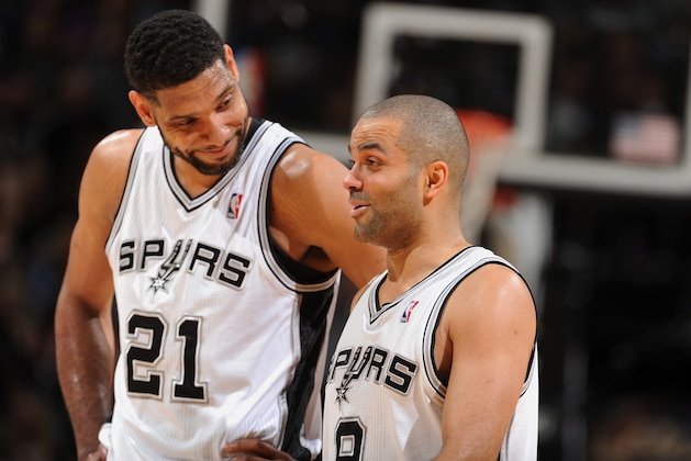 SAN ANTONIO, TX - MAY 4: Tim Duncan #21 and Tony Parker #9 of the San Antonio Spurs share a moment against the Dallas Mavericks in Game Seven of the Western Conference Quarterfinals during the 2014 NBA Playoffs on MAY 4, 2014 at the AT&T Center in San Antonio, Texas. NOTE TO USER: User expressly acknowledges and agrees that, by downloading and/or using this Photograph, user is consenting to the terms and conditions of the Getty Images License Agreement. Mandatory Copyright Notice: Copyright 2014 NBAE (Photo by Garrett W. Ellwood/NBAE via Getty Images)