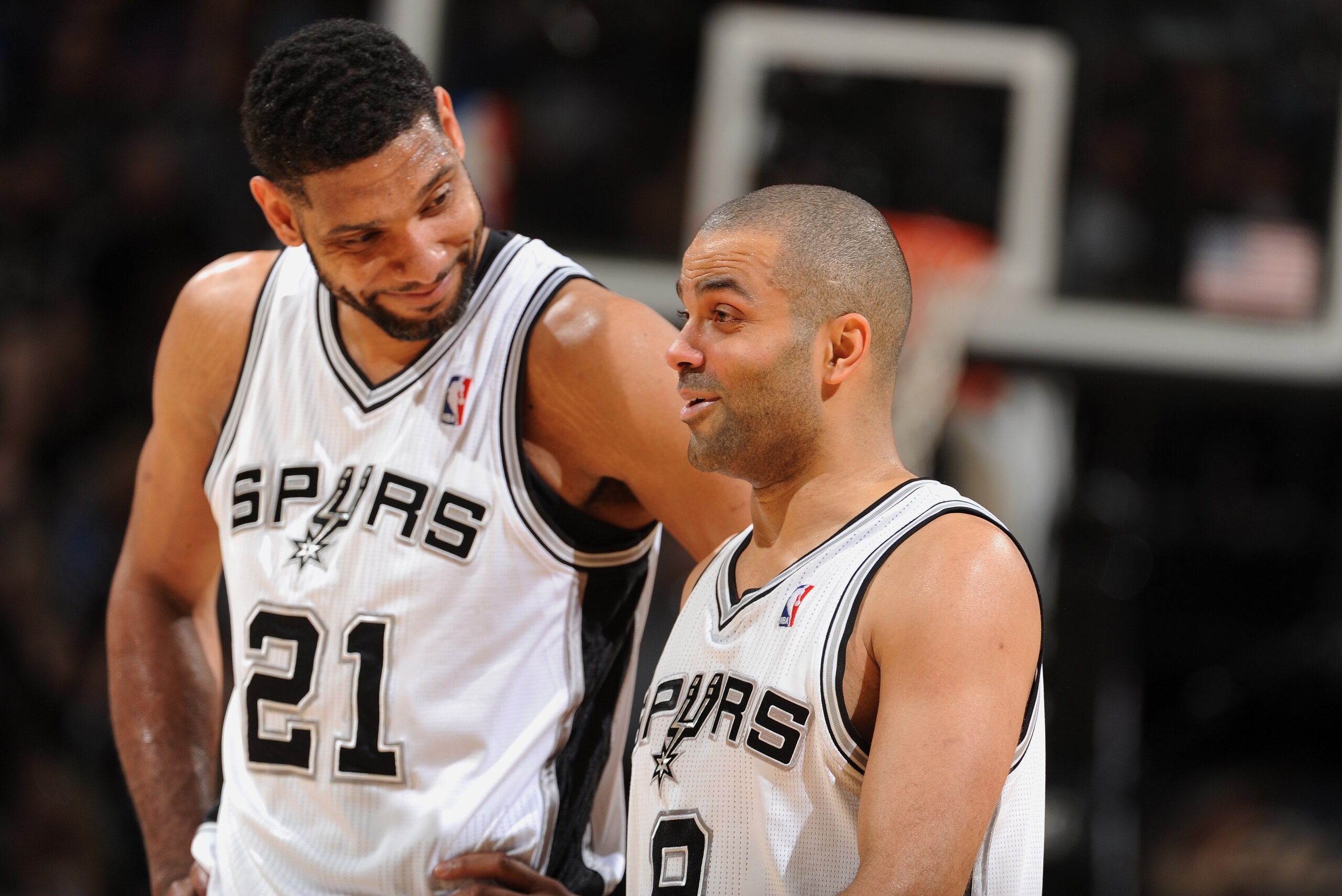 SAN ANTONIO, TX - MAY 4: Tim Duncan #21 and Tony Parker #9 of the San Antonio Spurs share a moment against the Dallas Mavericks in Game Seven of the Western Conference Quarterfinals during the 2014 NBA Playoffs on MAY 4, 2014 at the AT&T Center in San Antonio, Texas. NOTE TO USER: User expressly acknowledges and agrees that, by downloading and/or using this Photograph, user is consenting to the terms and conditions of the Getty Images License Agreement. Mandatory Copyright Notice: Copyright 2014 NBAE (Photo by Garrett W. Ellwood/NBAE via Getty Images)