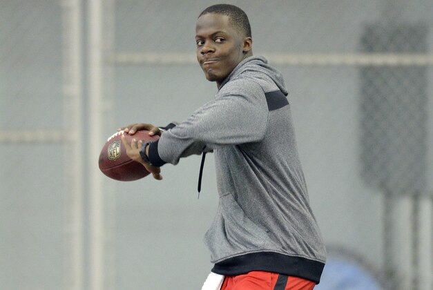 Louisville quarterback Teddy Bridgewater warms up before participating in passing drills for NFL representatives during pro day at the University of Louisville in Louisville, Ky., Monday, March 17, 2014. (AP Photo/Timothy D. Easley)