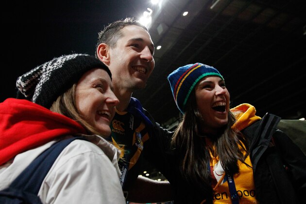 MANCHESTER, ENGLAND - NOVEMBER 30:  Billy Slater of Australia poses for photographs with fans after the Rugby League World Cup final between New Zealand and Australia at Old Trafford on November 30, 2013 in Manchester, England. (Photo by Paul Thomas/Getty Images)