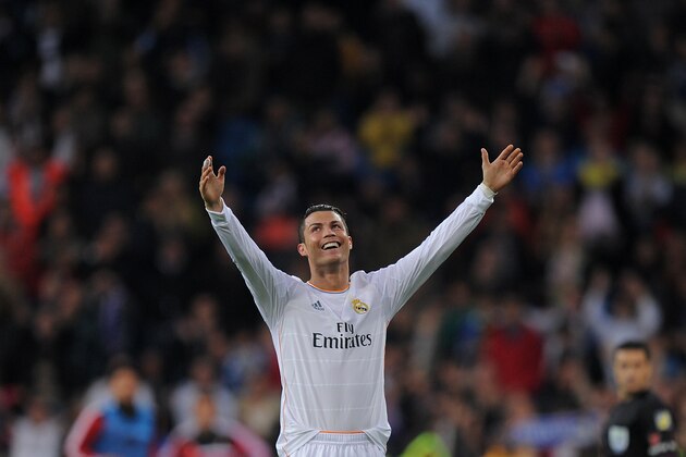 MADRID, SPAIN - APRIL 26:  Cristiano Ronaldo of Real Madrid CF celebrates after scoring Real's 2nd goal from a free kick during the La Liga match between Real Madrid CF and CA Osasuna at the Santiago Bernabeu stadium on April 26, 2014 in Madrid, Spain.  (Photo by Denis Doyle/Getty Images)