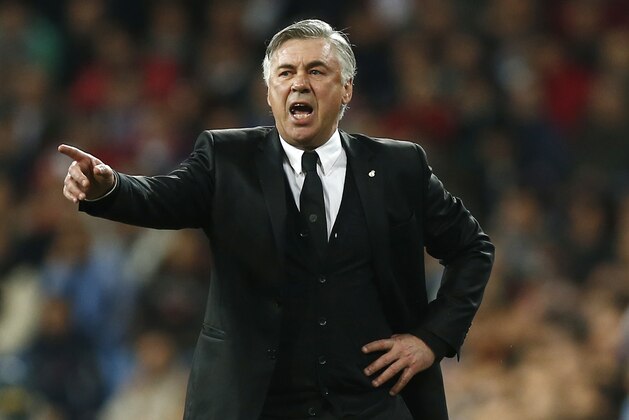 Real's coach Carlo Ancelotti directs his players during a Champions League quarterfinal first leg soccer match between Real Madrid and Borussia Dortmund at the Santiago Bernabeu   stadium in Madrid, Spain, Wednesday, April 2, 2014. (AP Photo/Andres Kudacki)