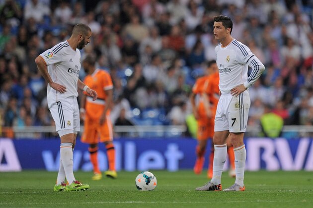 MADRID, SPAIN - MAY 04:  Cristiano Ronaldo and Karim Benzema of Real Madrid FC react after Valencia CF scored their 2nd goal during the La Liga match between Real Madrid CF and Valencia CF at Santiago Bernabeu stadium on May 4, 2014 in Madrid, Spain.  (Photo by Denis Doyle/Getty Images)