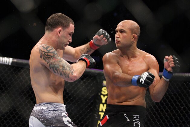 Frankie Edgar, left, in action against BJ Penn during their UFC fight at the TD Garden on Saturday, August 28, 2010 in Boston, MA. Edgar retained his UFC lightweight title via unanimous decision. (AP Photo/Gregory Payan)