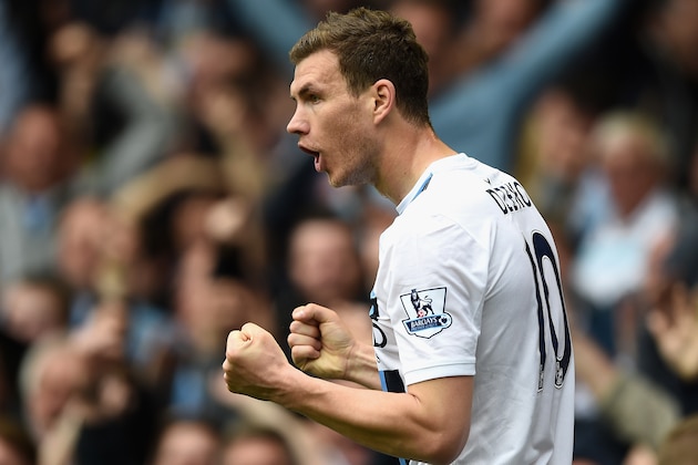 LIVERPOOL, ENGLAND - MAY 03:  Edin Dzeko of Manchester City celebrates scoring his team's second goal during the Barclays Premier League match between Everton and Manchester City at Goodison Park on May 3, 2014 in Liverpool, England.  (Photo by Laurence Griffiths/Getty Images)