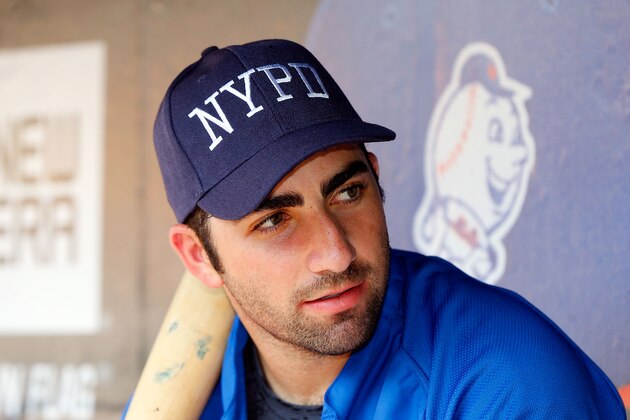 NEW YORK, NY - SEPTEMBER 11:  Josh Satin #13 of the New York Mets wears a New York City Police Department cap during batting practice prior to a game against the Washington Nationals at Citi Field on September 11, 2013 in the Flushing neighborhood of the Queens borough of New York City.  (Photo by Jim McIsaac/Getty Images)