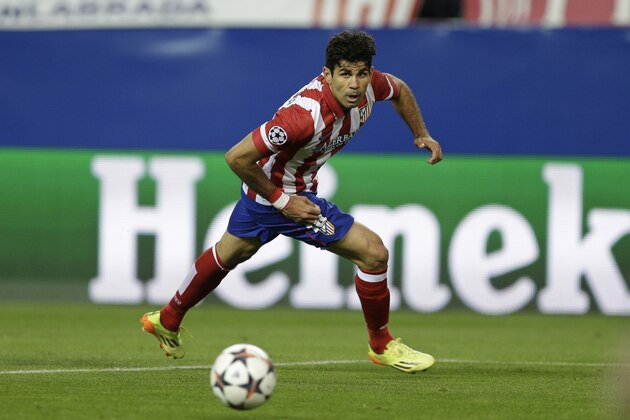 Atletico's Diego Costa runs with the ball during in semifinal, 1st leg Champions League soccer match between Atletico Madrid and Chelsea at the Vicente Calderon stadium in Madrid, Spain, Tuesday, April 22, 2014 .(AP Photo/Paul White)