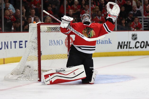 CHICAGO, IL - MAY 04: Corey Crawford #50 of the Chicago Blackhawks watches as a puck flies over his head against the Minnesota Wild in Game Two of the Second Round of the 2014 NHL Stanley Cup Playoffs at the United Center on May 4, 2014  in Chicago, Illinois.  The Blackhawks defeated the Wild 4-1. (Photo by Jonathan Daniel/Getty Images)