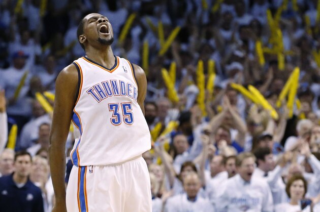 Oklahoma City Thunder forward Kevin Durant (35) reacts after a dunk late in the fourth quarter of Game 2 of an opening-round NBA basketball playoff series against the Memphis Grizzlies in Oklahoma City, Monday, April 21, 2014. Memphis won 111-105 in overtime. (AP Photo/Sue Ogrocki)