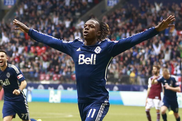 VANCOUVER, BC - APRIL 5:  Darren Mattocks #11 of the Vancouver Whitecaps FC celebrates his goal during their MLS game against the Colorado Rapids April 5, 2014 in Vancouver, British Columbia, Canada. Colorado won 2-1. (Photo by Jeff Vinnick/Getty Images)