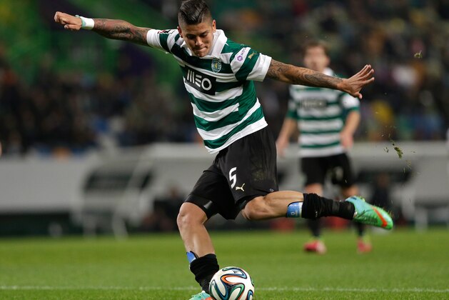 Sporting's Marcos Rojo, from Argentina,  kicks the ball during their Portuguese league soccer match with Academica Sunday, Feb. 2 2014, at Sporting's Alvalade stadium in Lisbon. (AP Photo/Armando Franca)