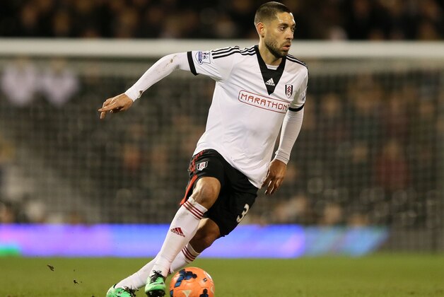Fulham's Clint Dempsey takes the ball forward during their 4th round replay English FA Cup soccer match between Fulham and Sheffield United at Craven Cottage stadium in London, Tuesday, Feb. 4, 2014. (AP Photo/Alastair Grant)