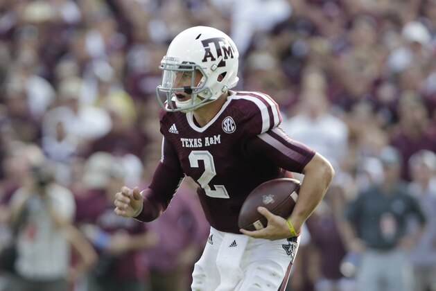 Texas A&M's Johnny Manziel runs against Alabama during the third quarter of an NCAA college football game Saturday, Sept. 14, 2013, in College Station, Texas. (AP Photo/Eric Gay)