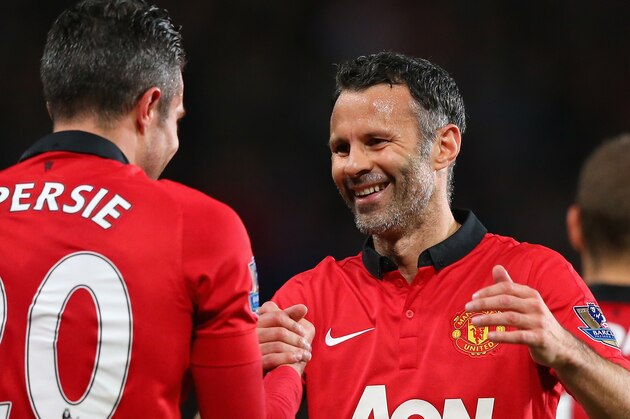 MANCHESTER, ENGLAND - MAY 06:  Robin van Persie of Manchester United is congratulated by Caretaker Manager Ryan Giggs after scoring his team's third goal during the Barclays Premier League match between Manchester United and Hull City at Old Trafford on May 6, 2014 in Manchester, England.  (Photo by Alex Livesey/Getty Images)