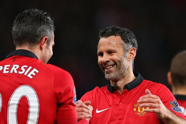 MANCHESTER, ENGLAND - MAY 06:  Robin van Persie of Manchester United is congratulated by Caretaker Manager Ryan Giggs after scoring his team's third goal during the Barclays Premier League match between Manchester United and Hull City at Old Trafford on May 6, 2014 in Manchester, England.  (Photo by Alex Livesey/Getty Images)