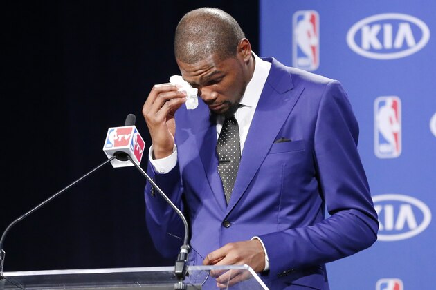 Oklahoma City Thunder's Kevin Durant wipes away tears as he speaks during a news conference to announce that Durant is the winner of the 2013-14 Kia NBA Basketball Most Value Player Award in Oklahoma City, Tuesday, May 6, 2014. (AP Photo/Sue Ogrocki)