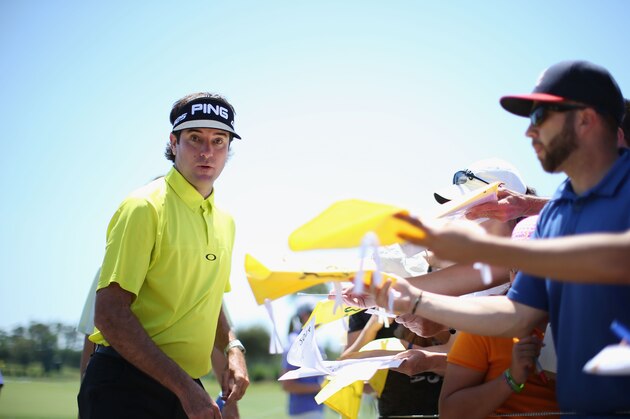 PONTE VEDRA BEACH, FL - MAY 06:  Bubba Watson of the USA signs autographs for spectators during a practice round ahead of THE PLAYERS Championship on The Stadium Course at TPC Sawgrass on May 6, 2014 in Ponte Vedra Beach, Florida.  (Photo by Richard Heathcote/Getty Images)